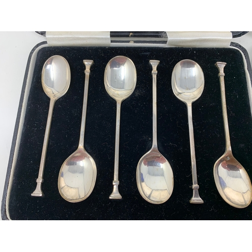 8 - A set of six silver teaspoons, in a Harrods case, another set similar, and a set of six silver coffe... 