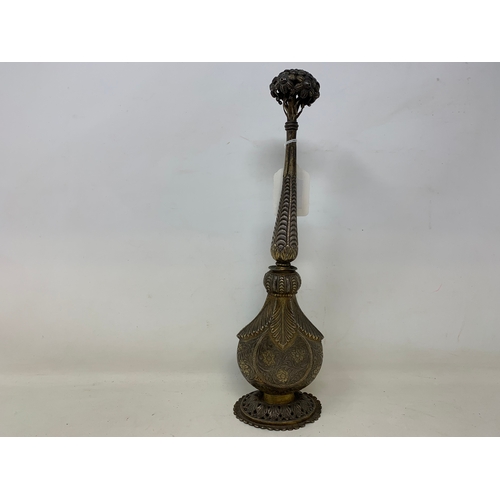 13 - An Indian silver coloured metal rosewater sprinkler, 31 cm high