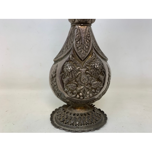 14 - An Indian silver coloured metal rosewater sprinkler, 31 cm high