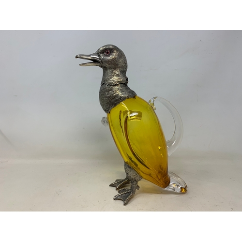 15 - A modern silver plated and amber glass claret jug, in the form of a duck, 28 cm high