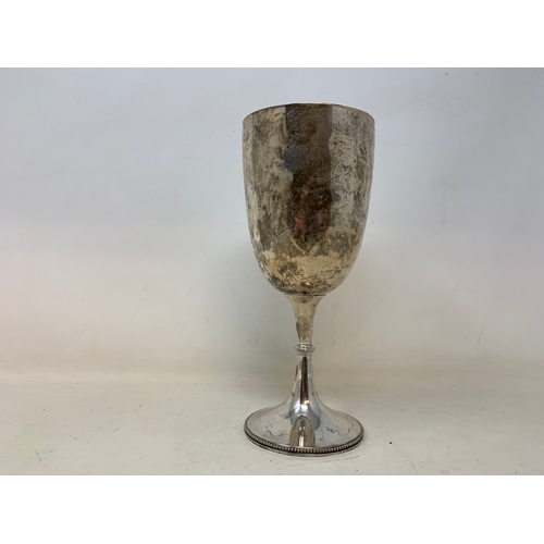 18 - A silver trophy goblet, indistinctly inscribed, Sheffield 1898, 8.0 ozt, 22 cm high