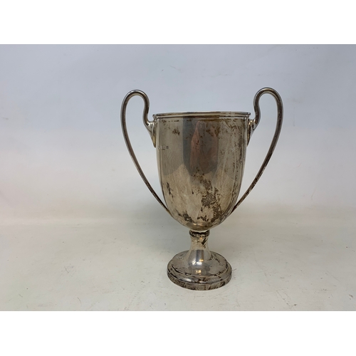 21 - A silver two-handle trophy, Birmingham 1919, 13.2 ozt, 20.5 cm high