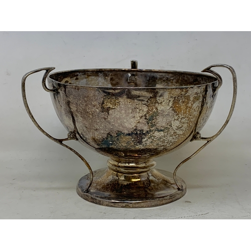 22 - An Arts & Crafts style Silver three-handle trophy, Birmingham 1912, 5.6 ozt, 10.5 cm high