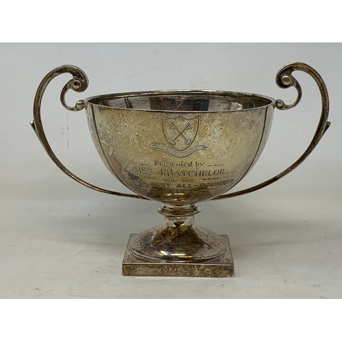 23 - A silver two-handle trophy cup, inscribed and dated 1949, London 1924, 7.7 ozt, 12.5 cm high