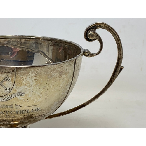 23 - A silver two-handle trophy cup, inscribed and dated 1949, London 1924, 7.7 ozt, 12.5 cm high