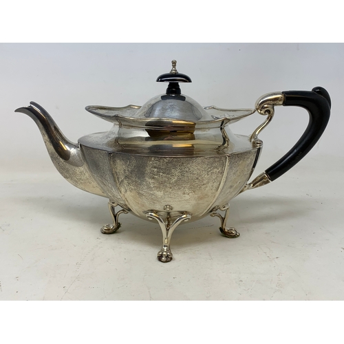 25 - A silver teapot, of shaped oval form, marks rubbed, probably Birmingham 1920, 19.1 ozt (all in), 14.... 