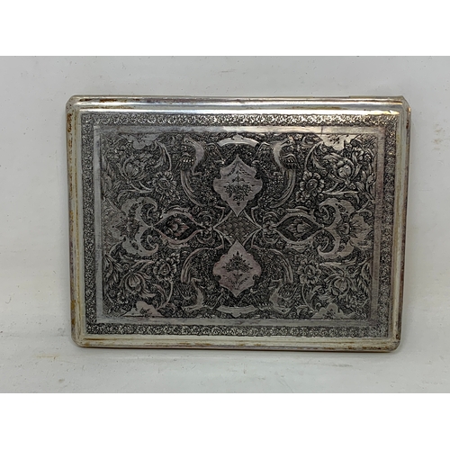 32 - A Persian silver coloured metal cigarette case, decorated birds, flowers and foliage, 10.5 cm wide