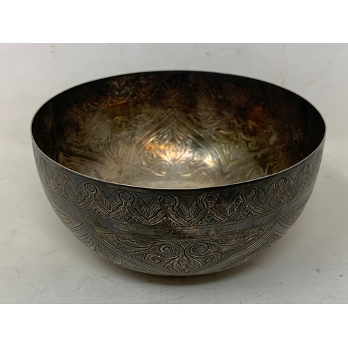 42 - A Continental silver coloured metal bowl, engraved foliage, 12 cm diameter