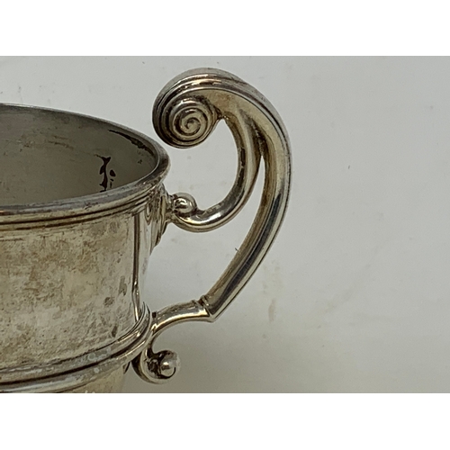 45 - A silver two handle trophy cup, London 1906, 7.7 ozt, 12 cm high