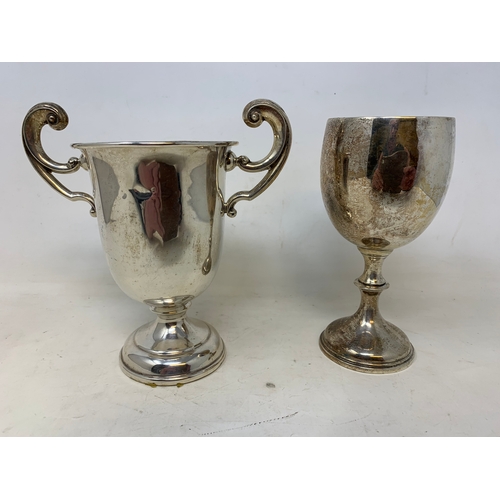 46 - Two silver trophy cups, 8.2 ozt