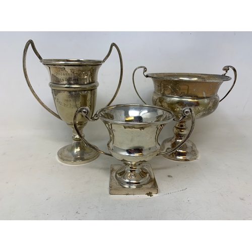 47 - Three silver two handle trophy cups, 8.3 ozt (3)