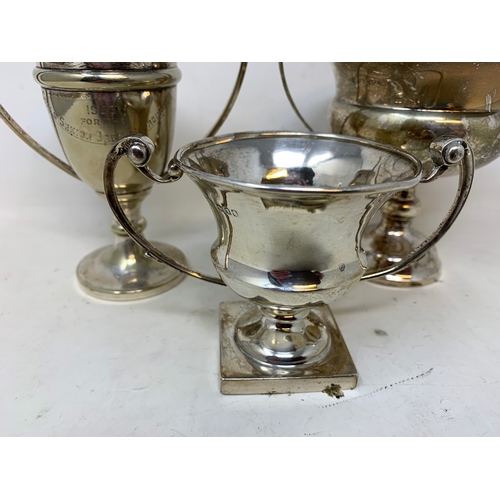 47 - Three silver two handle trophy cups, 8.3 ozt (3)