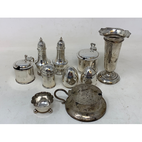 61 - A group of assorted silver condiments