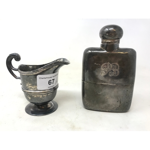 67 - A silver hip flask, initialled, marks rubbed, and a silver cream jug, 8.5 ozt (2)