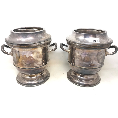 79 - A pair of silver plated wine coolers, with twin handles, 23.5 cm high