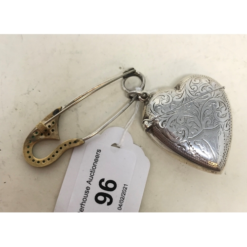 96 - A modern silver coloured metal novelty vesta, in the form of a heart, and a pin (2)