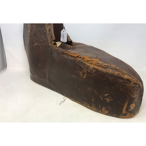640 - A 19th century large leather gout boot, 54 cm wide