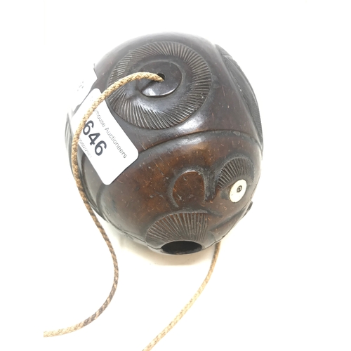 646 - A carved coconut bugbear flask, 14 cm wide