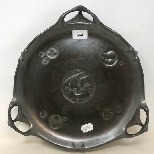 664 - An Art Nouveau Kayzerzin pewter stand, with central roundel embossed with galleons, 36 cm diameter