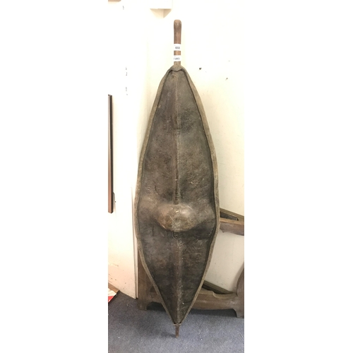668 - A hide shield, possibly Kenyan, 137 cm high