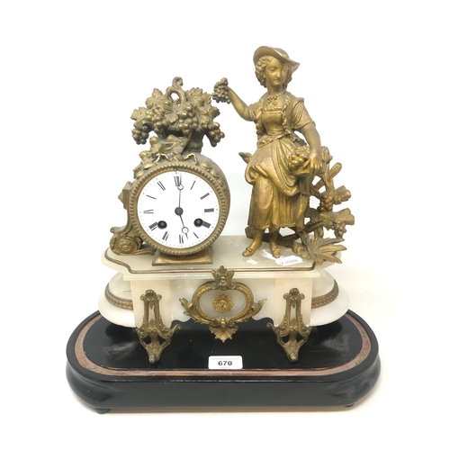 670 - A late 19th century mantel clock, with Roman numerals, in a gilt spelter and alabaster figural case,... 