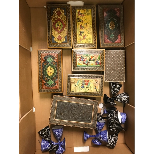 673 - A Persian style box, painted figures playing polo, 6.5 cm wide, seven other similar boxes, and a gro... 