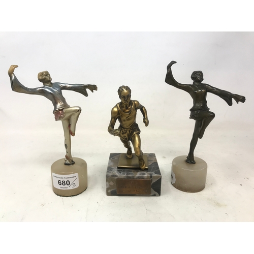 680 - An Art Deco spelter figure, of a lady dancing, on an alabaster base, 17 cm high, another matching, a... 