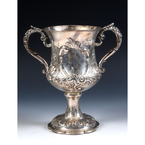 17 - A large Victorian silver two-handle trophy cup, with rococo style embossed decoration, London 1861, ... 