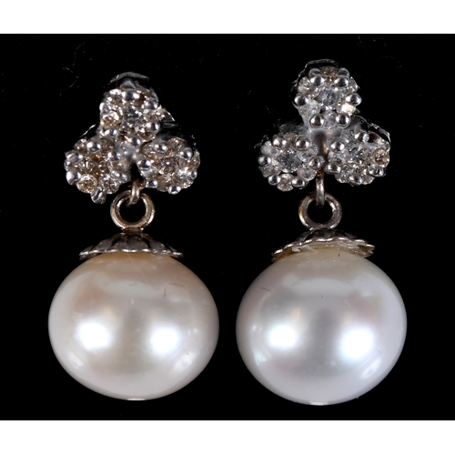 181 - A pair of white gold, diamond and pearl drop earrings