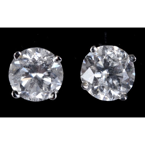 240 - A pair of white gold and diamond stud earrings, approx. 1.41ct