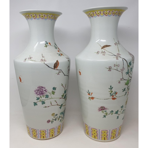 315 - A pair of modern Chinese famille rose vases, decorated flowers, 47 cm high