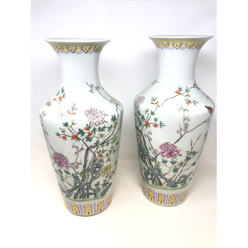 315 - A pair of modern Chinese famille rose vases, decorated flowers, 47 cm high