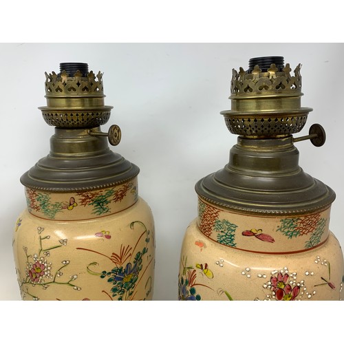 304 - A pair of Japanese Satsuma pottery lamps, with brass mounts, 39 cm high (2)