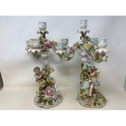 305 - A pair of Continental porcelain four light candelabra, some damages/repairs, and nine porcelain bird... 