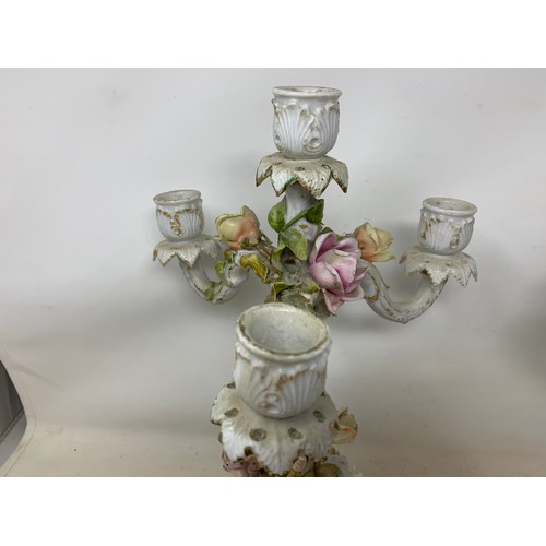 305 - A pair of Continental porcelain four light candelabra, some damages/repairs, and nine porcelain bird... 