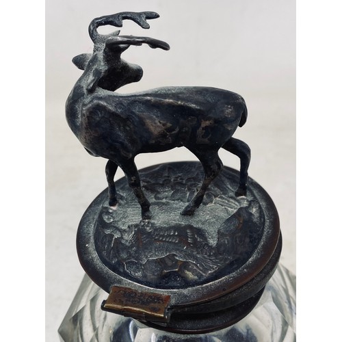 408 - A 19th century cut glass and silver plated inkwell, the finial in the form of a stag, 16 cm high