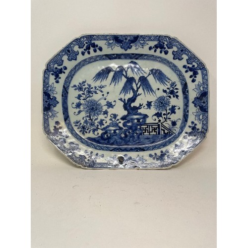 653 - An early 19th century Chinese meat plate, decorated flowers and foliage in underglaze blue, rim chip... 