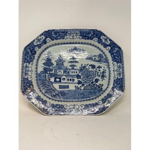 657 - An early 19th century Chinese meat plate, decorated dwellings and flowers in underglaze blue, 45.5 c... 