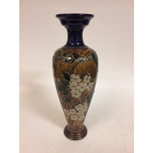 614 - A Royal Doulton stoneware vase, decorative flowers, impressed mark to base, 43 cm high