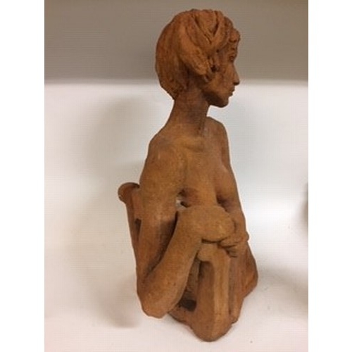 613 - An earthenware sculpture, of a nude lady, 56 cm high