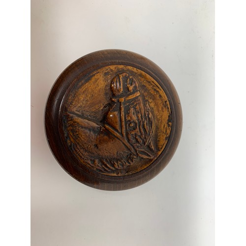 480 - A treen snuff box, the cover carved a horse's head, the inside with a paper label inscribed and date... 