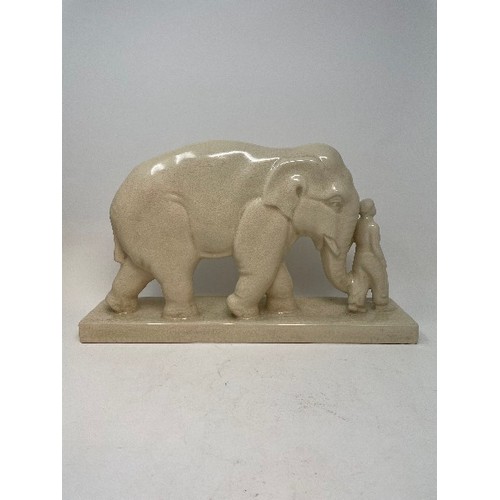 620 - A pottery group, of an elephant and attendant, 25 cm high