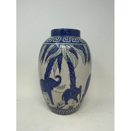 626 - A pottery vase, decorated elephants, 28 cm high