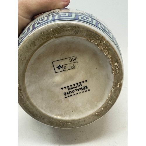 626 - A pottery vase, decorated elephants, 28 cm high