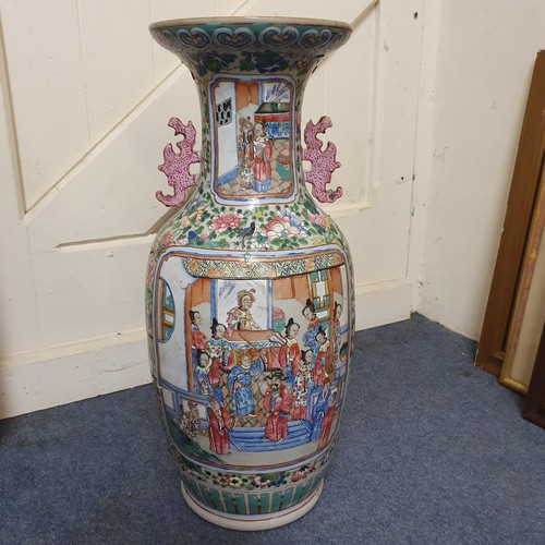 658 - A Chinese famille rose export vase, decorated figures, birds and foliage, riveted and glued, 59.5 cm... 