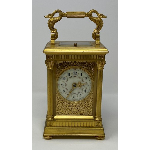 241 - A good carriage clock with repeat, the 5.5 cm diameter dial with Arabic numerals and painted floral ... 