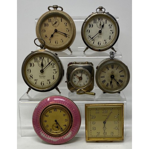 251 - Assorted small alarm clocks, and other items