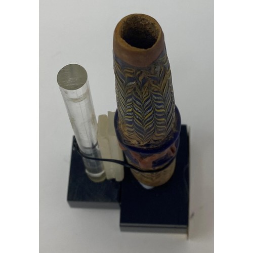 560 - A Roman style (Phoenician) Punic core glass unguentarium (tube) from Spain, on a stand, 13 cm...