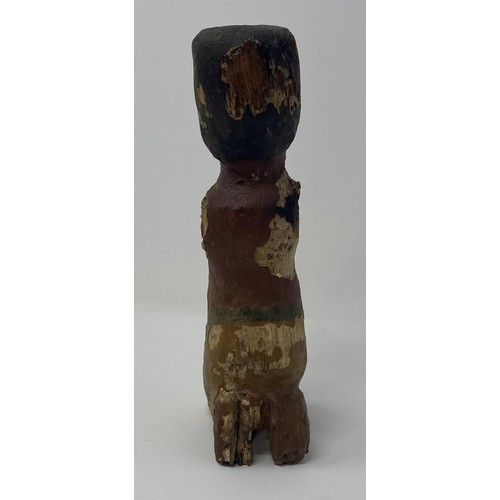 562 - An Egyptian style wooden boatman figure, with painted decoration to face and body 50 cm...