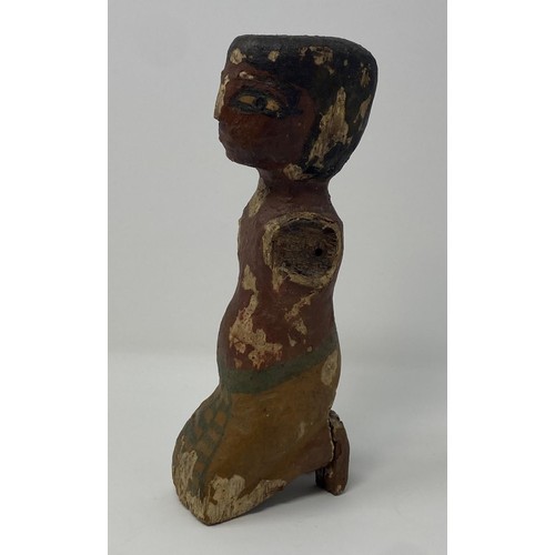 562 - An Egyptian style wooden boatman figure, with painted decoration to face and body 50 cm...